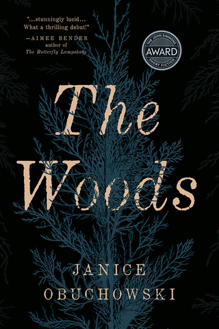 book cover: moody with gold, writing tangled in fir tree