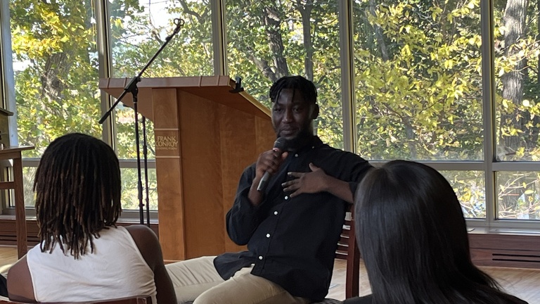 Arinze Ifeakandu holding microphone
